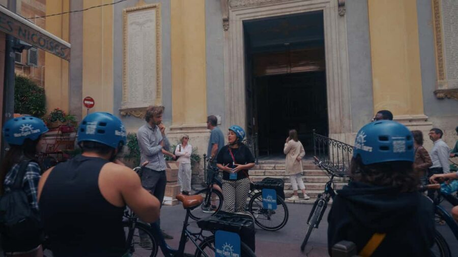Nice: City Highlights Bike tour - Place Garibaldi and the port: yachts, fishing boats, and contrast