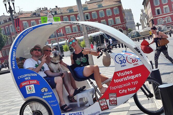 Private tour guide of Nice in electric taxibikes - Place Masséna, Fontaine du Soleil, and the Opéra de Nice facade views